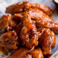 Chicken Wings · Celery & bleu cheese dressing, tossed in your choice of sauce.