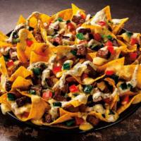 Sirloin Steak Nachos · USDA choice cut sirloin, queso, cheddar jack & cotija cheeses, fire roasted red peppers, oni...