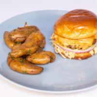 Grass Fed Brunch Burger · Toasted brioche bun, beef patty, aged cheddar, onion jam, mayo, fresh lettuce, red onion, Th...