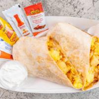 Breakfast Burrito · Our BOMB Breakfast Burritos are loaded with potatoes, eggs, cheese, bacon, ham, sausage/chor...