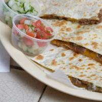 Whole Works Quesadilla · Served with choice of meat with guacamole, sour cream and cheese
