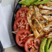Grilled Chicken Salad · Grilled chicken, lettuce, tomatoes, avocado, cucumbers, cheese and your choice of homemade t...
