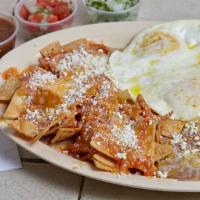 Chilaquiles Platter · Tortilla chips wet with our special tomato red sauce with cheese. Served with 2 eggs and a s...