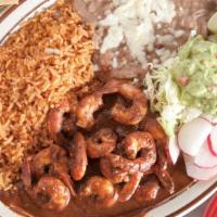 Camarones Al Chipotle · Shrimp cooked with creamy chipotle sauce. Served with rice, beans, guacamole, and tortillas.