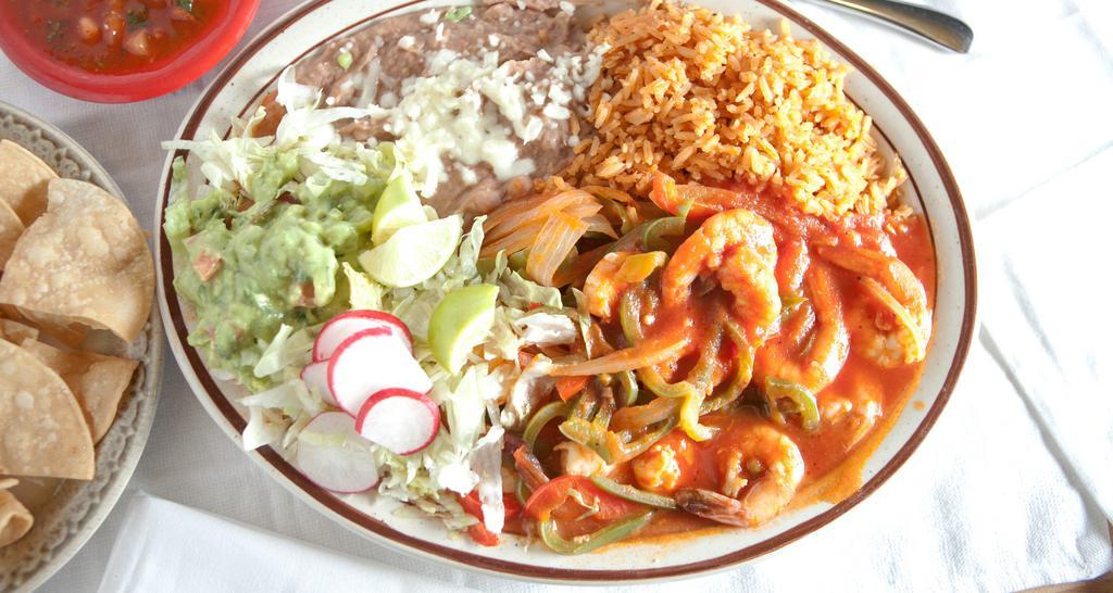 Camarones Rancheros · Shrimp cooked with ranchero sauce, bell peppers, onions, tomatoes and served with rice, beans, guacamole and tortillas.