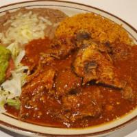 Chile Colorado Platillo · Pieces of pork cooked with mild red sauce. Served with rice, beans, guacamole and tortillas.