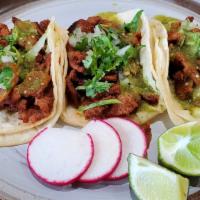 Taco · Popular item. Choice of steak, chicken, al pastor , birria, or carnitas. Topped with onions,...