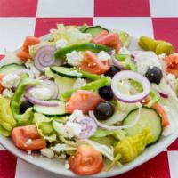 Greek Salad · Fresh iceberg lettuce, cucumbers, tomatoes, onions, bell peppers, pepperoncini, feta cheese,...