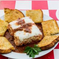 Lasagna · Layers of seasoned ricotta cheese, mozzarella cheese, beef & sausage baked in Sam's own mari...