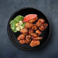 Chicken Comrade · (10 Pcs) Boneless pieces of chicken marinated with curd and other spices and char-grilled to...