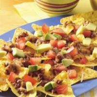 Nacho Deluxe · Includes: chips, cheese, beans and chicken.