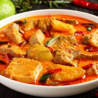 Fish Curry · Delicious fish cooked in brown curry sauce.