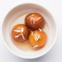 Gulab Jamun · Milk balls soaked in flavored syrup.
