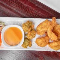 Thai Tempura · Choice of shrimp, squid or vegetable. Lightly batter served with sweet and sour sauce.