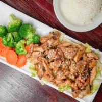 Teriyaki Chicken · Grilled marinated chicken served with teriyaki sauce on the bed with letuce.