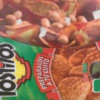 Tostilocos · They come with , pork grinds , jicama,cucumber,Japanese peanuts,tamarind candy , chamoy , sa...