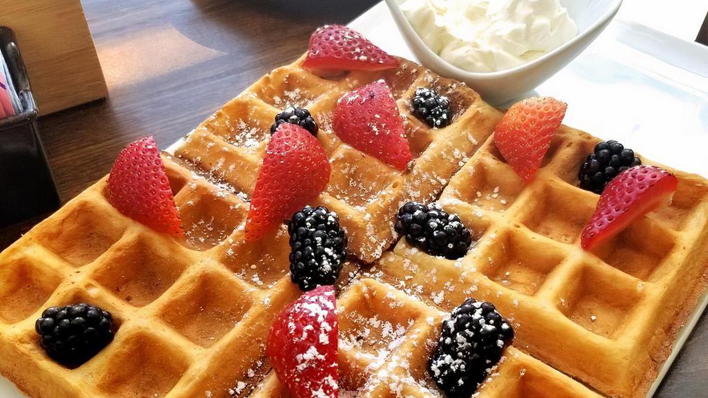 Waffles · Classic Belgian waffles topped with fresh berries
