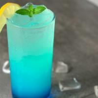 Blue Lemonade · Blue syrup + Lemonade + Ice + topped with lemon slices