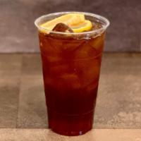 Peach Iced Tea · Peach Syrup + Golden Tea + Ice