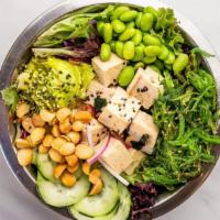 Veggie Bowl · Tofu, mixed greens, avocado, macadamia nuts, edamame, cucumber, wakame, red onion, rice, cla...