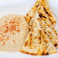 Hummus And Pita · Vegan and served with pita