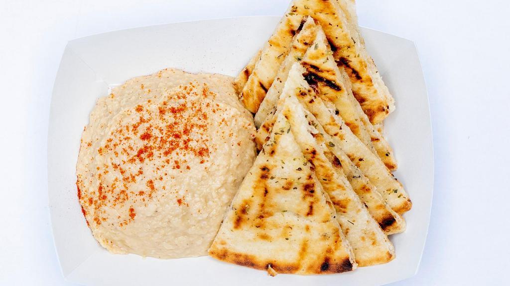 Hummus And Pita · Vegan and served with pita