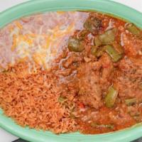 Costillas Con Nopales · Two chicken enchiladas with mole sauce rice and beans. served with rice refried beans and to...