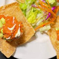 Sushi Tortilla · Spicy tune on fried wonton skins with wasabi mayo sauce.