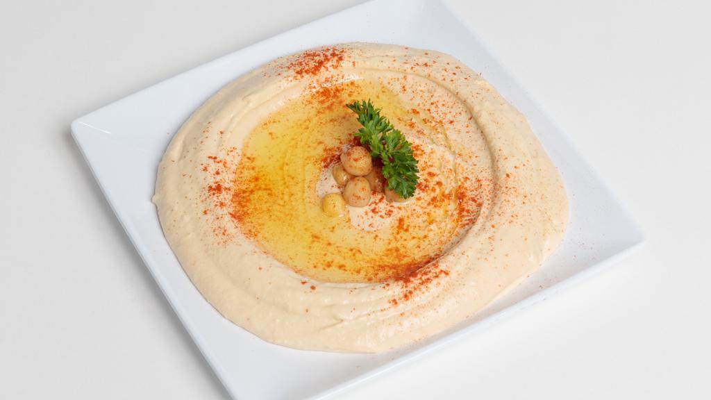 Pita & Hummus · Garbanzo beans blended with garlic, lemon juice, tahini and extra virgin olive oil served with pita bread.