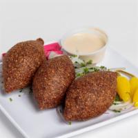 Fried Kibbeh · Extra lean ground beef mixed with cracked wheat, roasted pine nuts, caramelized onion, and f...