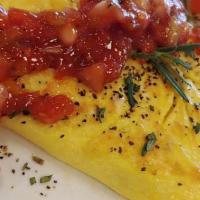 Omelette With Bread, Bacon Or Sausage Or Ham · Served with Bread and Tomato Chutney Sauce.
Omelette: Mushrooms, Spinach, Cheese
1.Veggie Om...