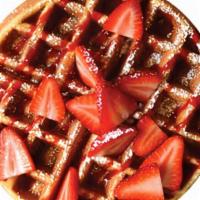 Strawberry Waffle · A golden brown waffle topped with strawberries and lightly dusted with powdered sugar. Serve...
