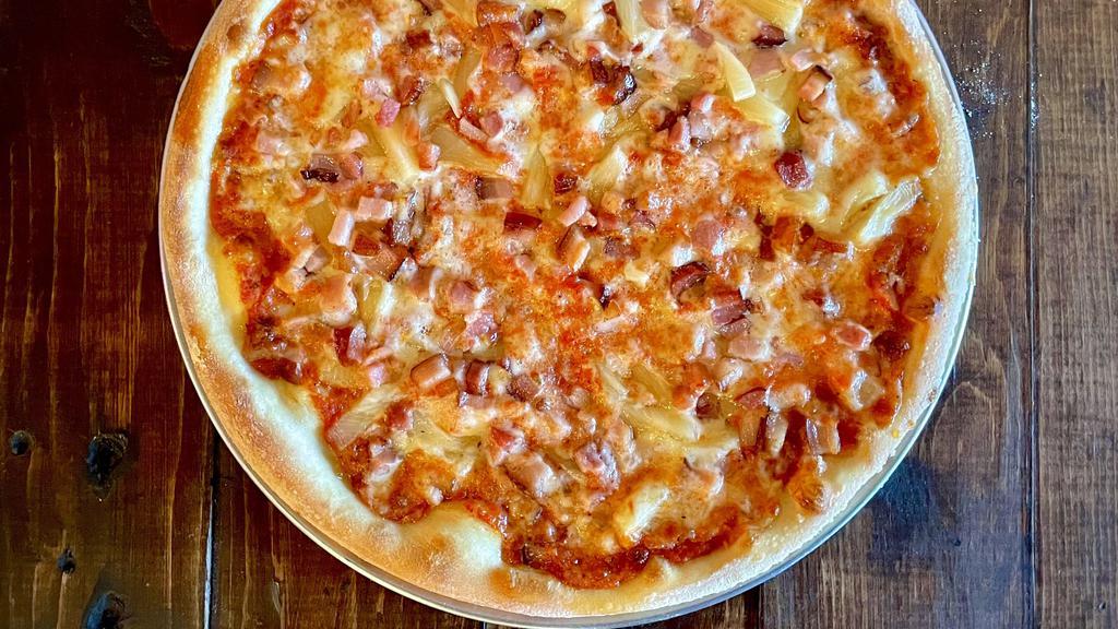 The Maui Pizza · Imported Italian pancetta, fresh maui pineapples, mozzarella cheese, our signature tomato sauce.