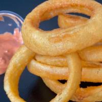 Beer Battered Onion Rings · Beer battered maui onion rings cooked to crunchy perfection.
