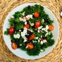 Kale Salad · Kale, baby spinach, medjool dates, cherry tomatoes, dijon mustard vinaigrette balsamic glaze.