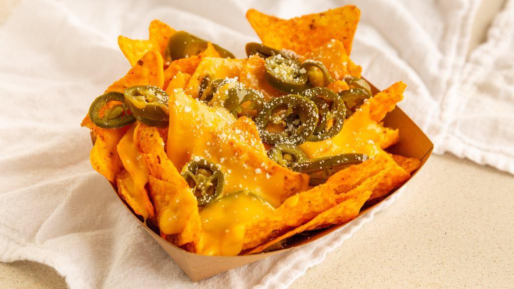 Dorinachos · Two bags of Doritos with nacho cheese, cotija cheese, and jalapenos.