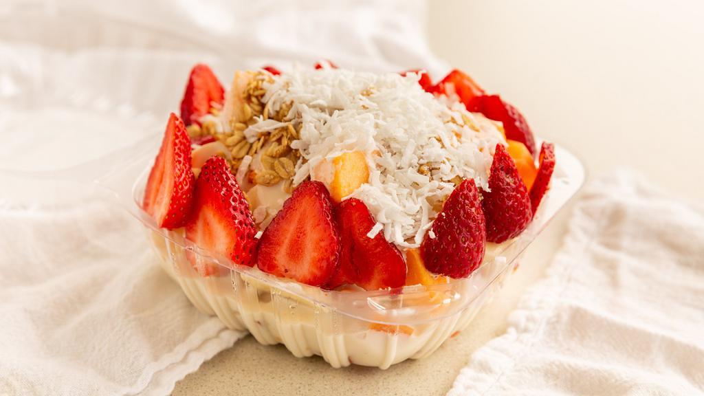 Bionico · Apples, cantaloupe, papaya, banana, strawberries, topped with our secret recipe sweet cream, shredded coconut and granola.