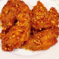 Fried Chicken · Signature crispy golden garlic fried chicken (3 pieces).
