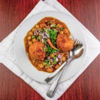 Samosa Chana · A fried pastry with savory fillings, spiced potatoes, peas, onions and ginger topped with ch...