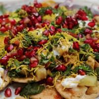 Chaat · Mixture of potatoes pieces, crispy fried bread, Dahi vada, chick peas, tangy-salty spices an...