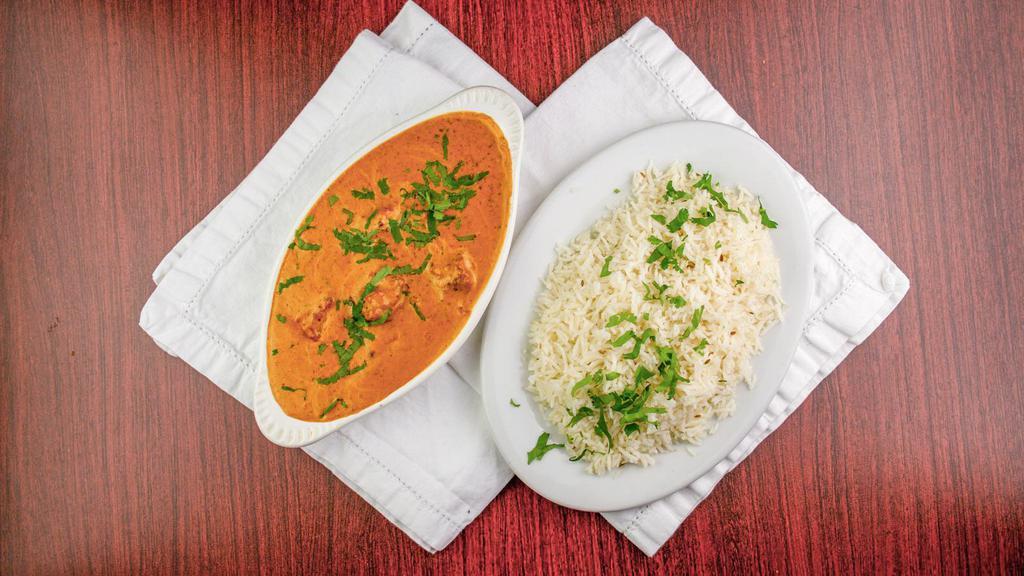 Butter Chicken · Marinated pieces of boneless chicken in creamy masala sauce served with basmati rice.