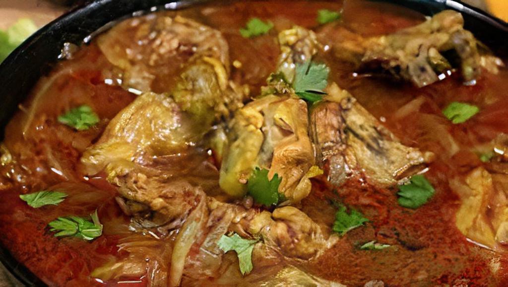 Chicken Curry · Boneless chicken stewed in onion and tomato sauce with ginger, garlic and chilies.