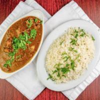 Goat Curry · Small piece of goat in curry sauce with special spices and basmati rice.