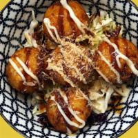 Takoyaki Appetizer · 5 pieces. Crispy octopus balls served with mayo and takoyaki sauce and bonito flakes on top.