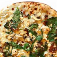 Garlic Chicken Pizza · White sauce, chicken, bacon, mushroom, feta, garlic, oregano, mozzarella, spinach.