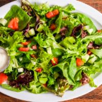 Garden Salad · Spring mix, cucumbers, Roma tomatoes, red onion, ranch or blue cheese dressing.