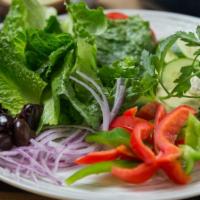 Greek Salad · Non-vegetarian. Romaine lettuce, tomatoes, green and red bell peppers, onions, kalamata oliv...