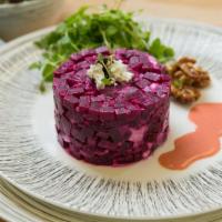 Summer Beet Salad · Marinated beets on our homemade style strawberry and basil vinaigrette dressing. Topped with...