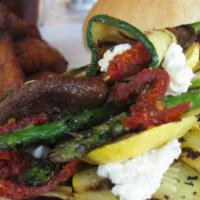 Vegetarian Sandwich · Marinated charbroiled vegetables, sundried tomatoes, and a homemade style goat cheese mix sp...