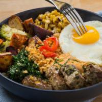 Beef Tenderloin Bowl · Broiled tenderloin tossed in chimichurri sauce topped with a sunny side up egg.